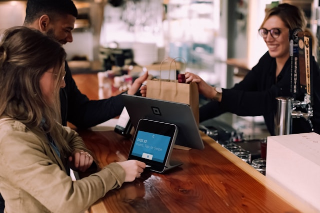 People using fintech devices