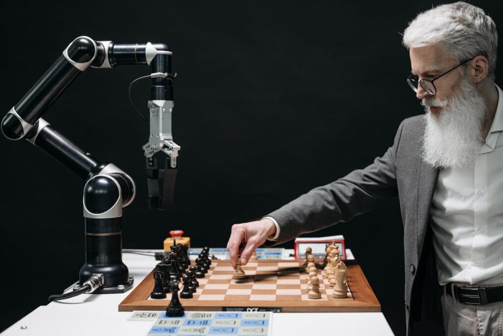 A beard man playing chess with a robot